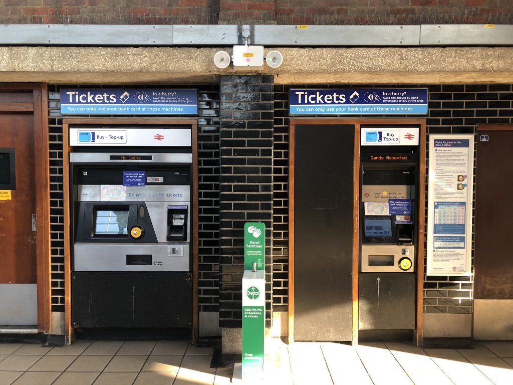 Ticket spot at London Underground station for Oyster Card top-up both for pay as you go and travel card with signature yellow kiosk. Photo by twitter user @JoshNeicho
